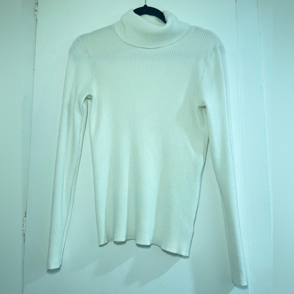 Ribbed cream turtleneck sweater. Size M. Light weight. Perfect for layering!